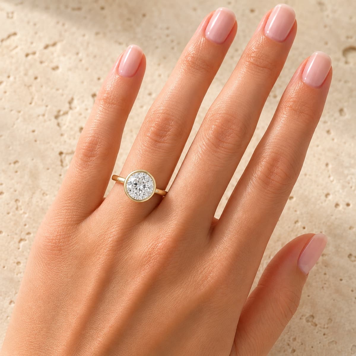 A bezel ring on the hand, showing how a band should sit