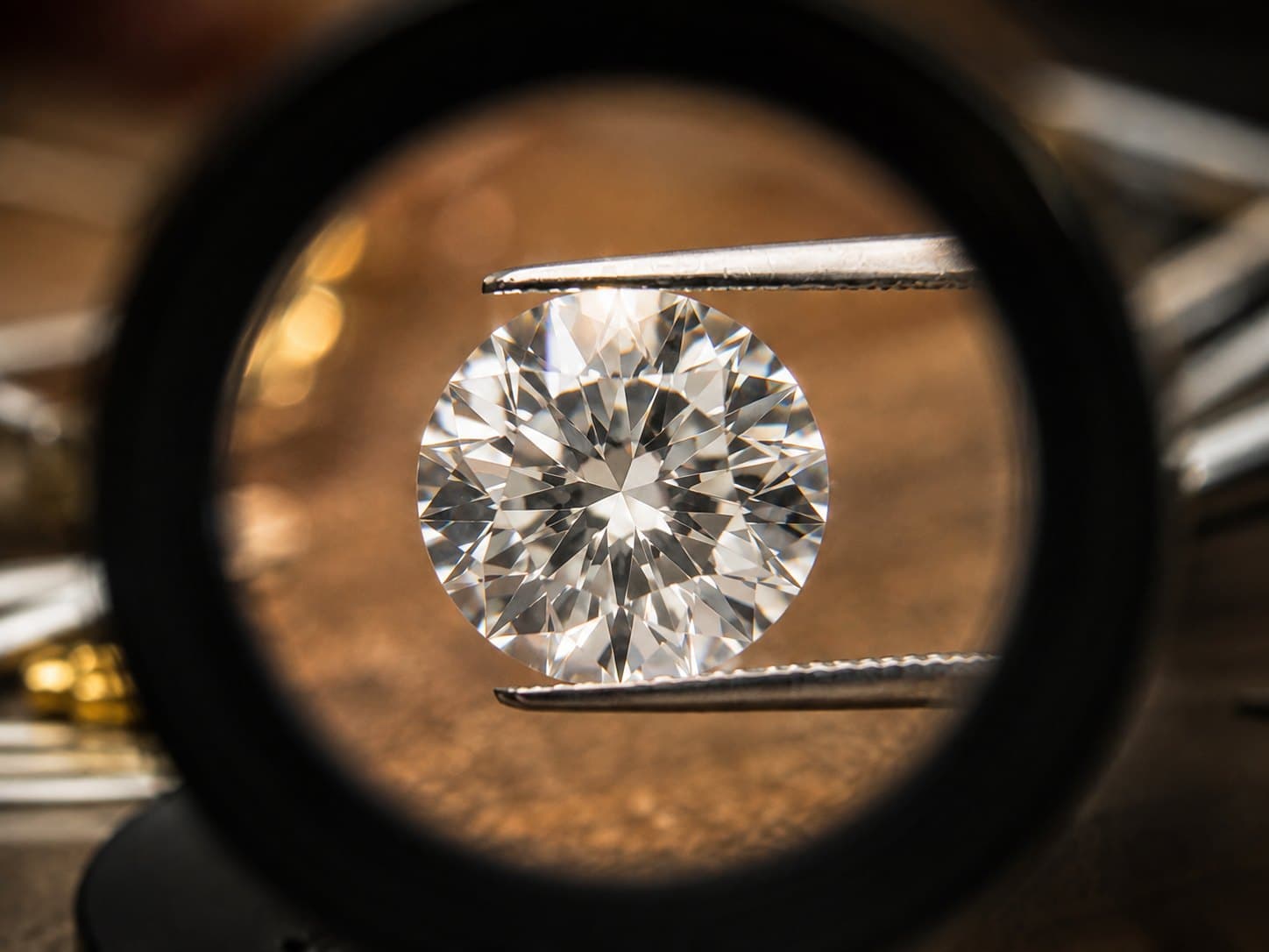 A loose diamond seen through a jeweler's loupe